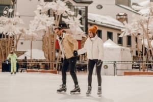 Couple ice skating in the Beaver Creek Village in the Rocky Mountains