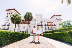 Loving couple walking towards the Casa Monica Resort & Spa